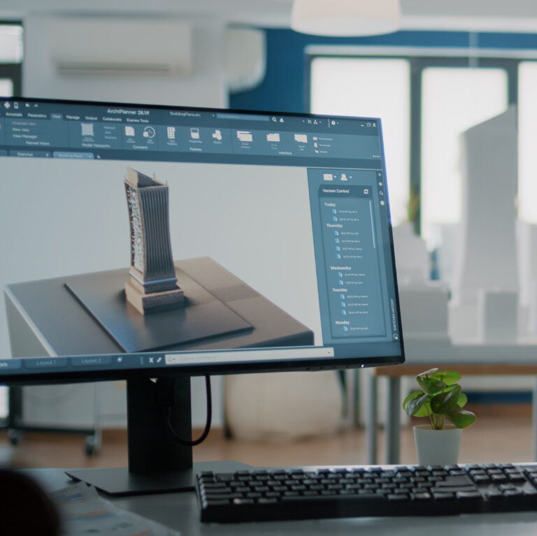 Close up of 3d building model on computer screen in empty office for architectural design